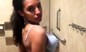 stunning-ebony-girl-peels-off-her-clothes-in-a-public-toilet