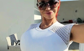 sexy-milf-shows-off-her-fabulous-bust-in-a-tight-white-top