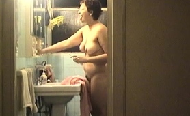 Mature Brunette Wife Reveals Her Big Boobs In The Bathroom