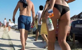 Beach Voyeur Follows Sexy Slender Babe In Tight Bikini